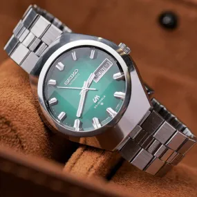 SEIKO LORD MATIC LM AUTOMATIC DAY-DATE FACETED CRYSTAL GREEN DIAL REF. 5606-7360