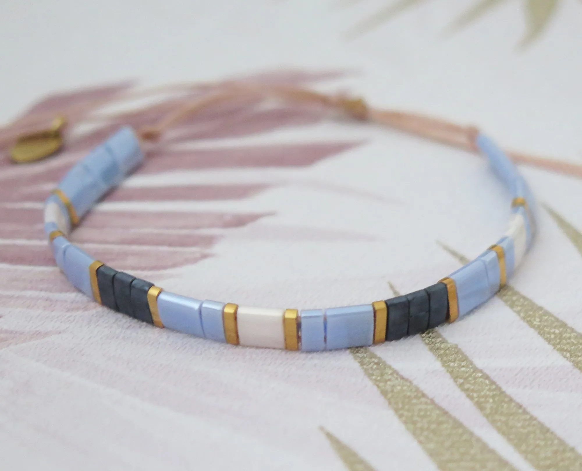 Tila Bead Adjustable Bracelet in Navy Blue, Iridescent Blue, Gold and Iridescent White
